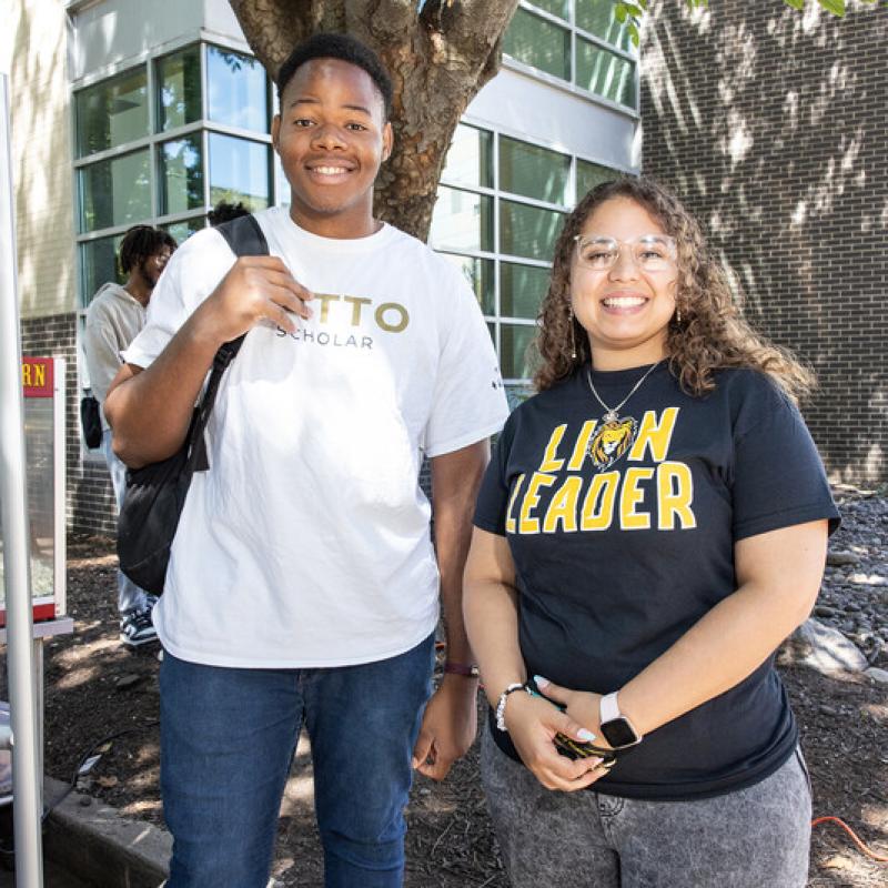 two catto scholar students smiling at camera