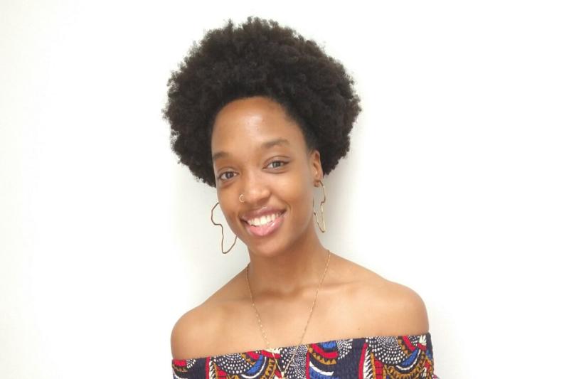 Essence Smiling at the Camera
