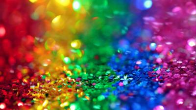 Sparkles in the colors of the rainbow flag