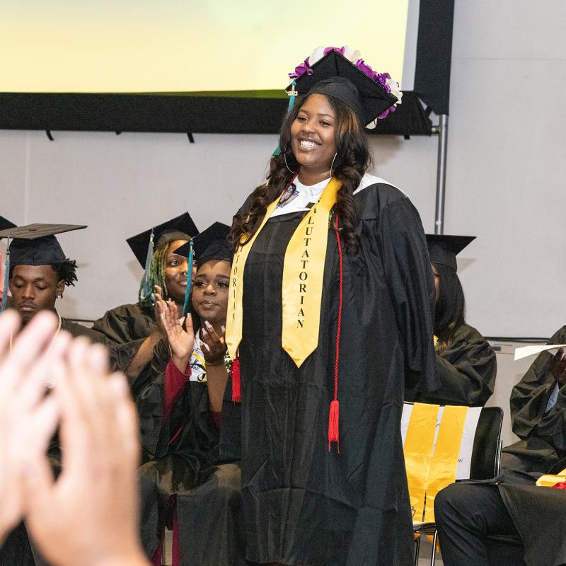 Student smiling during Gateway to College graduation