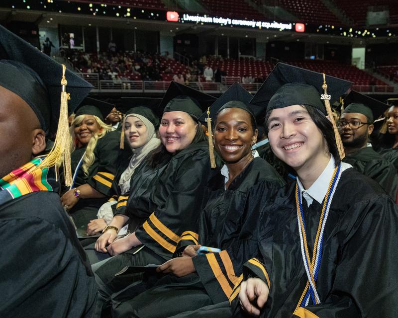 Group of students smiling at Commencement